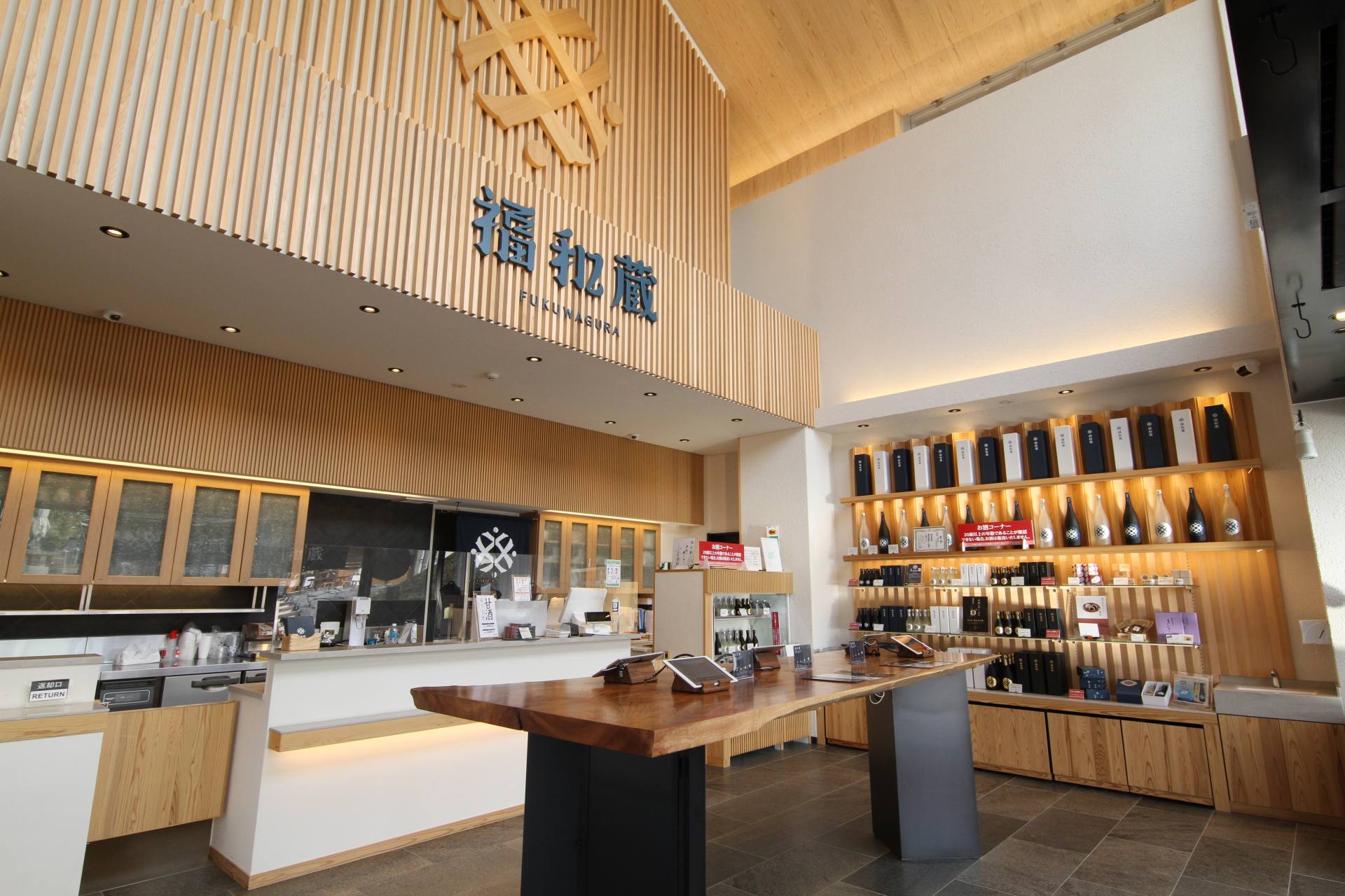 The high-ceilinged, spacious interior includes both a shop and a dining area
