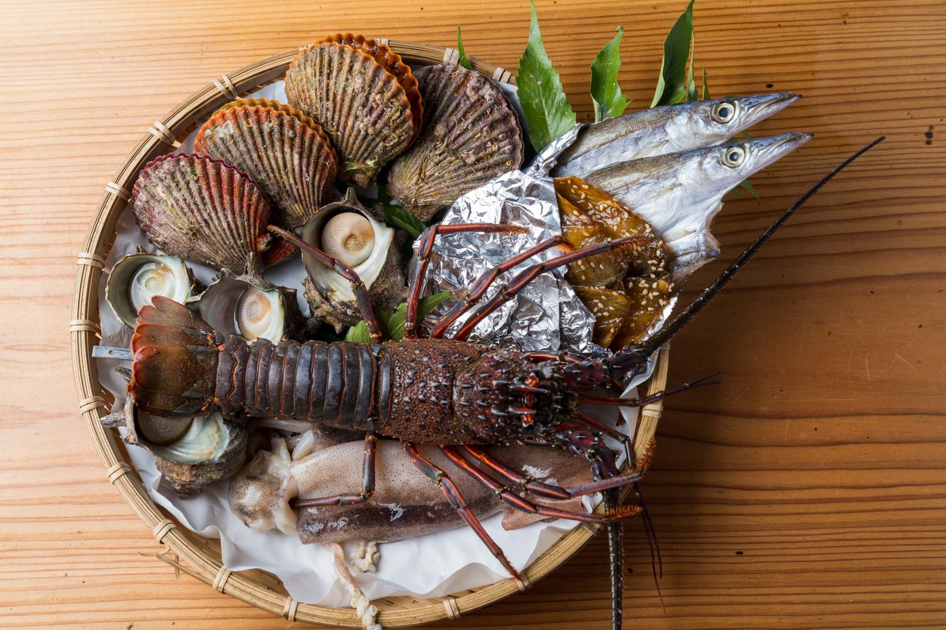 Fresh seafood from Ise-Shima, including lobsters, turban shells and noble scallops.