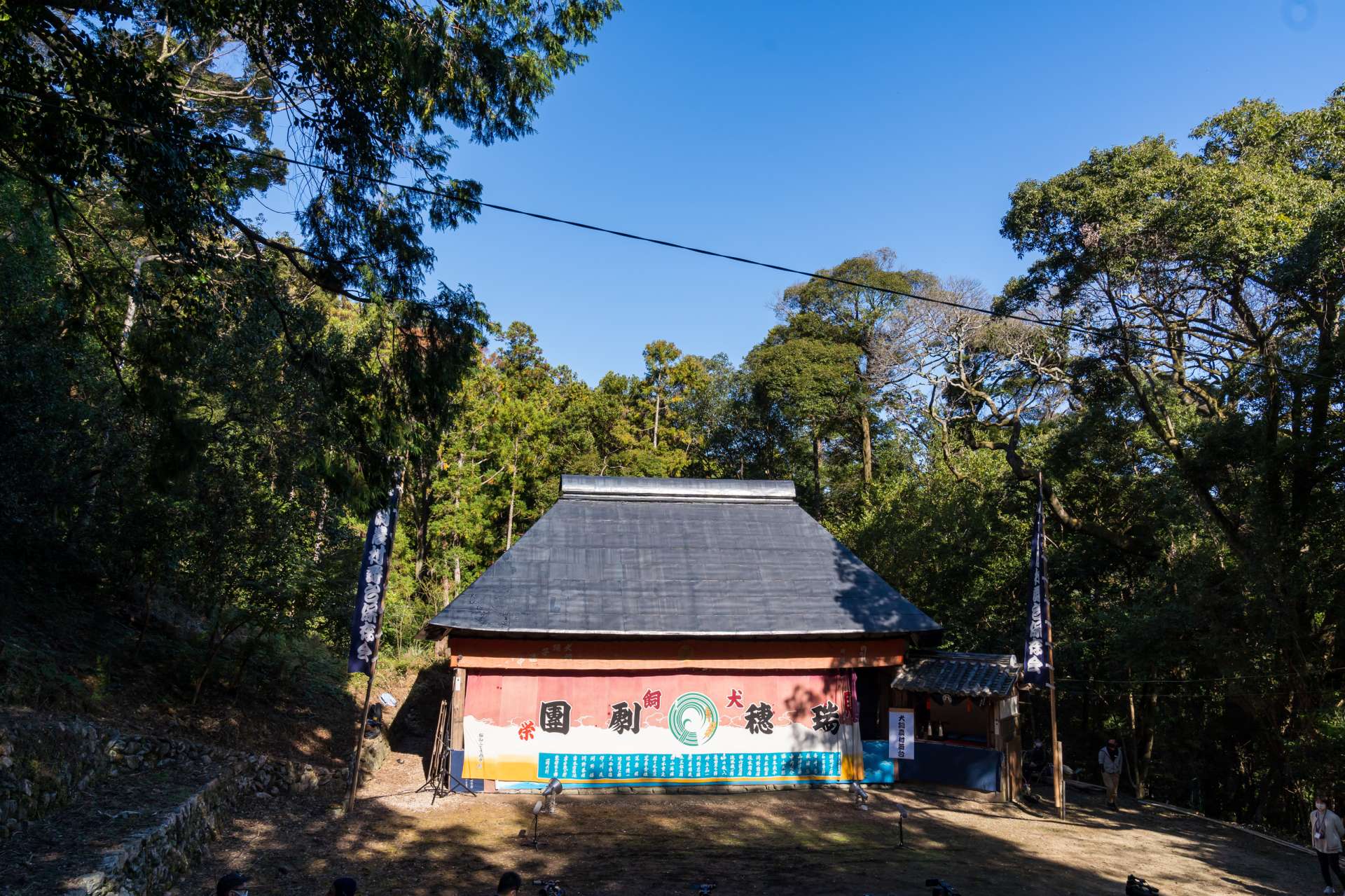 Inukai Noson Butai, an outdoor ningyo joruri stage that stands on the grounds of a shrine forest.