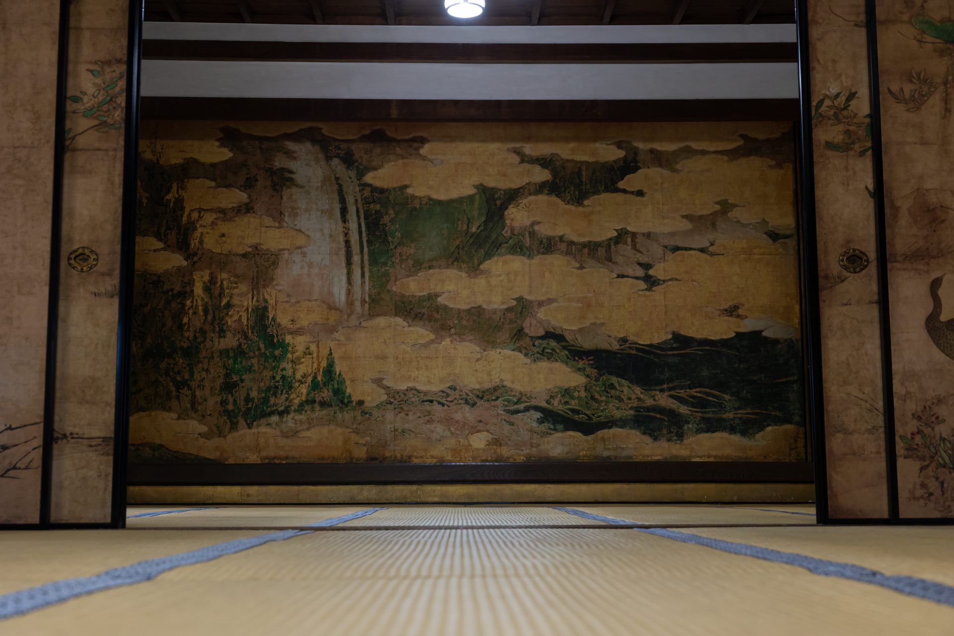 Room partitions covered in original paintings by the Kano school (of Japanese painting). This is of a waterfall, called “Ichinoma no Takizu.”