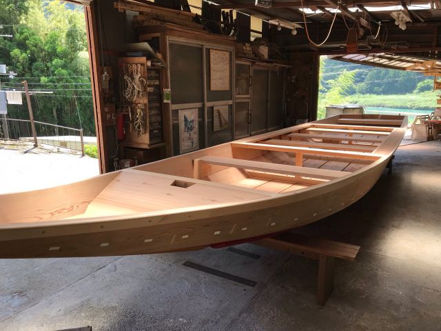 An adjacent riverboat workshop making riverboats