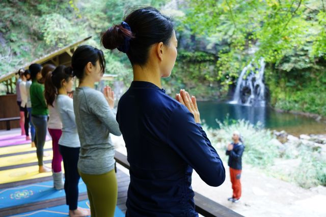 Meditation on the yoga meditation terrace with a view of the Senju waterfall.