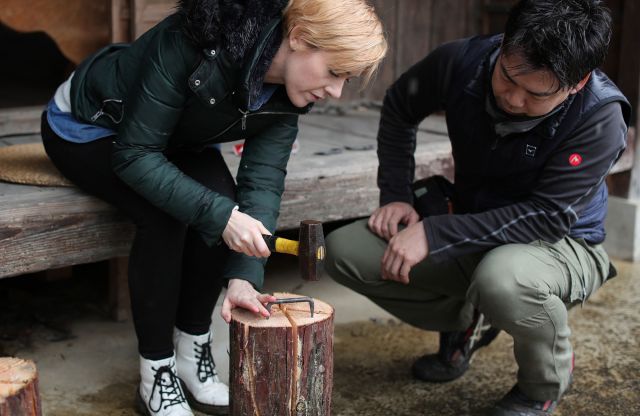 Preparing lunch over a wooden candle