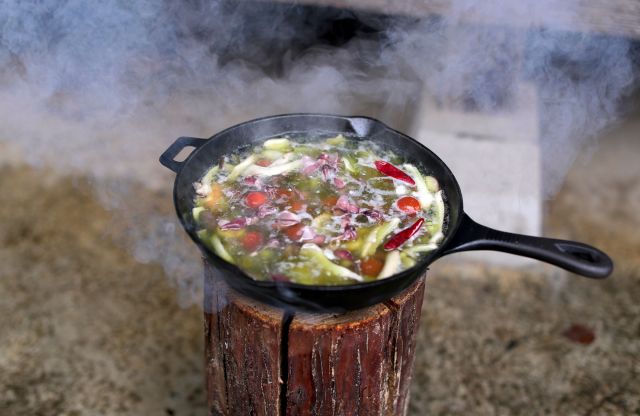 Cooking over the wooden candle bonfire