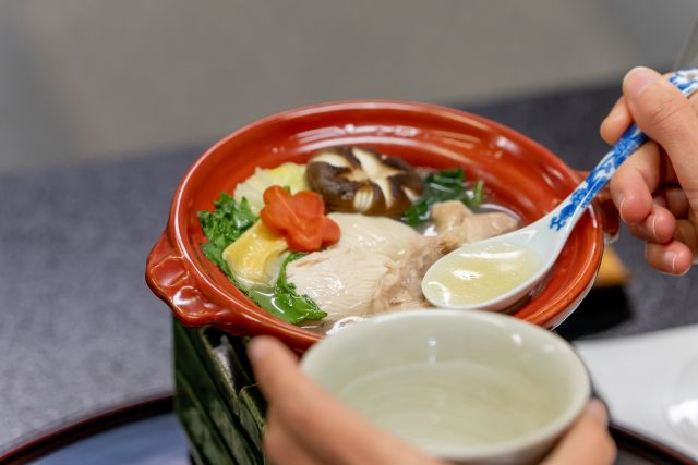 Specialty chicken hot pot served in a small pot