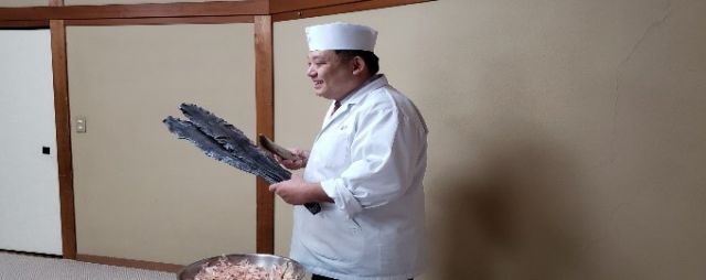 The head of the restaurant gives a class on the culture of dashi stock