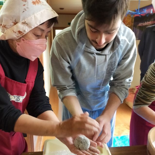 Chat with the local women's group as you make mochi