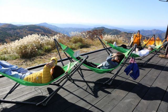 After some exercise, it's time to relax in a hammock over a wooden deck with a view down the slopes