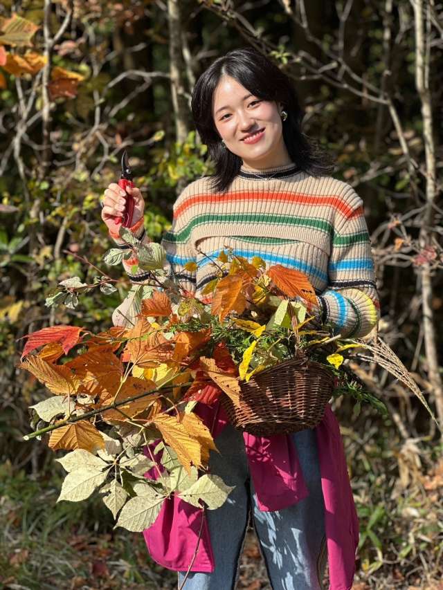 Picking some fragrant mountain herbs on stroll through the park's forests in the morning