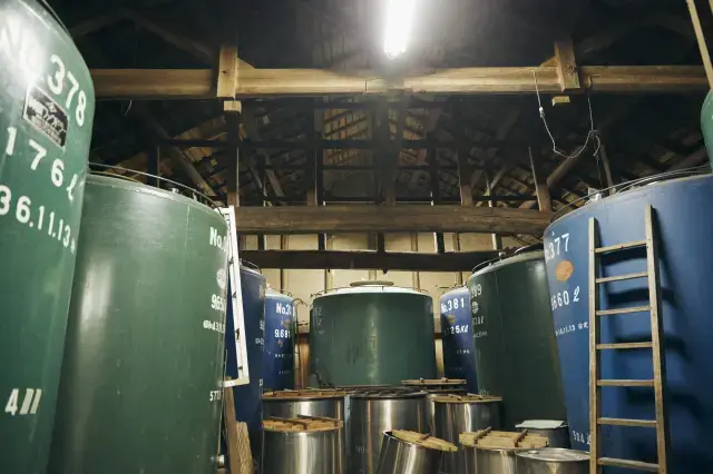 Sake brewing tanks and storage tanks.