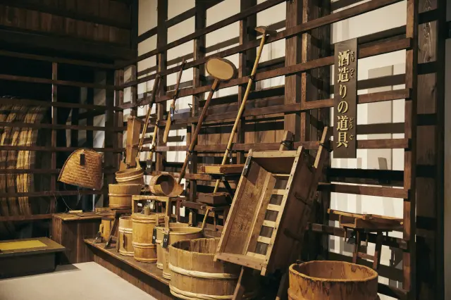 Inside the Sake Museum. Traditional sake brewing tools are on display.